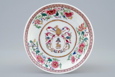 A Chinese famille rose armorial cup and saucer for the Dutch market, Yongzheng/Qianlong