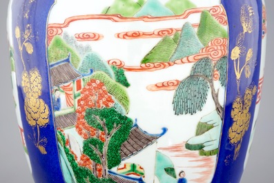 A Chinese famille verte powder blue ground vase and cover, 19th C.