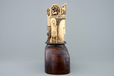 A Chinese carved ivory head of Buddha on wooden stand, 19th C.