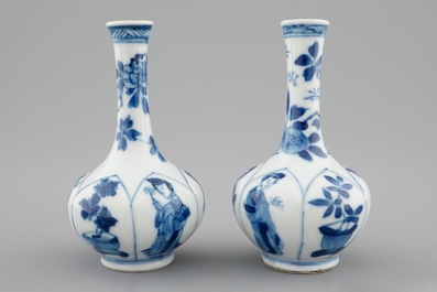 A pair of Chinese blue and white bottle shaped vases with long Elizas, Kangxi