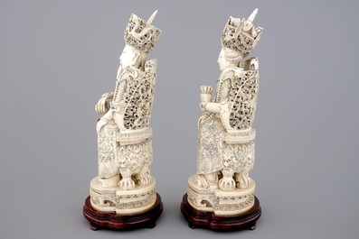 A tall pair of Chinese ivory figures of the emperor couple seated on a throne, ca. 1900