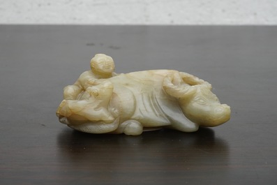 A Chinese jade group of a boy on a buffalo, 18/19th C.