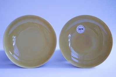 A pair of Chinese yellow glazed saucer dishes with incised backs, Qianlong sealmark and poss. of the period