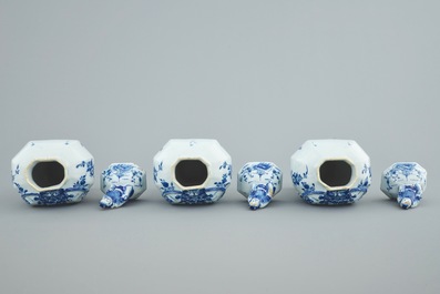 A Dutch Delft blue and white three-piece garniture with chinoiserie landscapes, 18th C.