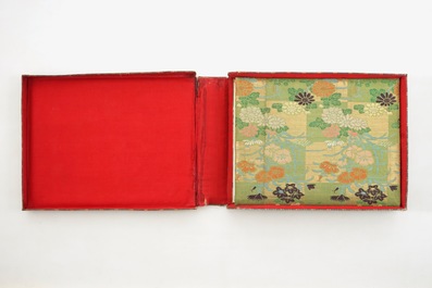 A Japanese photo album with 50 polychrome albumine photos, in original box, 19th C.