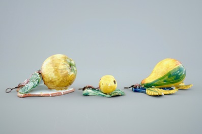 A set of three pieces of polychrome Dutch Delft models of fruit, 19th C.