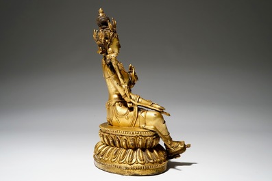 A Sino-Tibetan gilt bronze figure of Green Tara (Syamatara), 18/19th C.