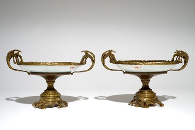 A pair of Chinese bronze-mounted famille rose plates with bats and peaches, Guangxu, 19/20th C.