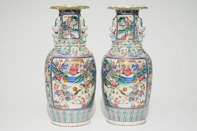 A pair of Chinese famille rose vases with court scenes, 19th C.