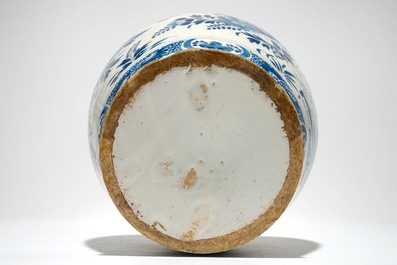 A Dutch Delft blue and white jar with putti design, 18th C.