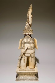 A pair of massive ivory groups of Guanyin seated on an elephants, 19th C.