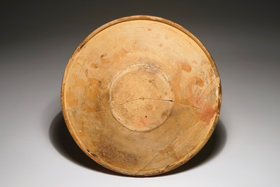 A Werra red earthenware pottery plate with a man's bust, dated 1611