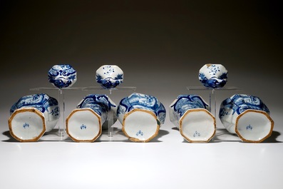 A Dutch Delft blue and white five-piece garniture with a hunter, 19th C.