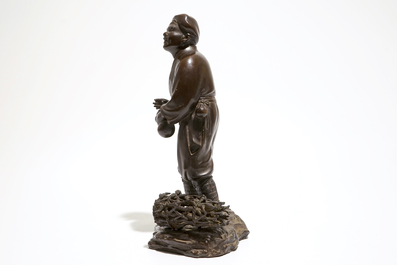 A Japanse bronze figure of a man with a double gourd, Meiji