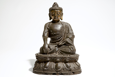 A Chinese bronze model of a seated Buddha Shakyamuni, Ming