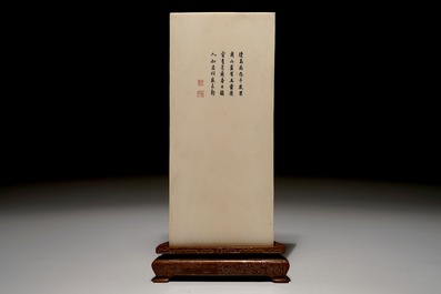 A Chinese carved ivory plaque with immortals on wooden stand, 2nd quarter 20th C.