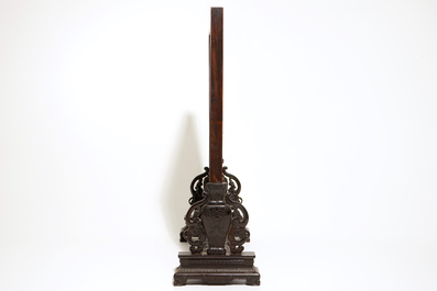 A Chinese zitan and huanghuali wood table screen with famille rose inset plaque, early 19th C.