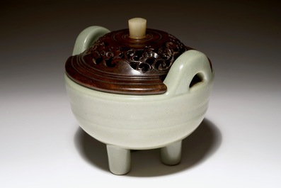 A Chinese tripod celadon censer with jade-inset wooden cover, 19th C.