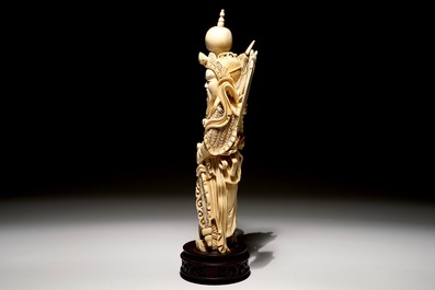 A Chinese carved ivory figure of a warrior on a wooden base, late 19th C.