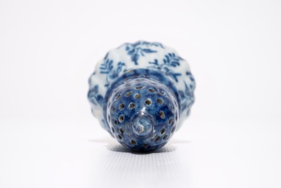 A Dutch Delft blue and white floral caster, 18th C.