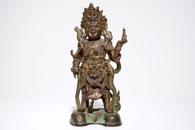 A tall Chinese gilt bronze figure with traces of polychromy, Ming