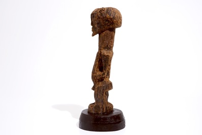 A Songye fetish on wooden base, D.R. Congo, 1st half 20th C.