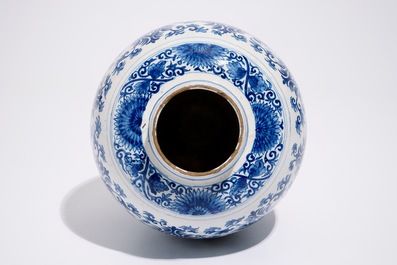 A Dutch Delft blue and white jar with peony scrolls in Ming-style, late 17th C.