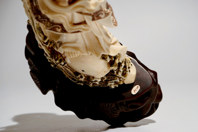 A Japanese ivory model of Guanyin on a carp, Taisho, ca. 1930, signed