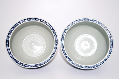 A pair of Chinese blue and white lotus scroll fishbowls, 19th C.