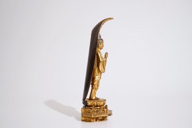 A Japanese lacquered and gilt wood &quot;Zushi&quot; shrine with a standing Buddha on a lotus throne, Edo, 17/18th C.