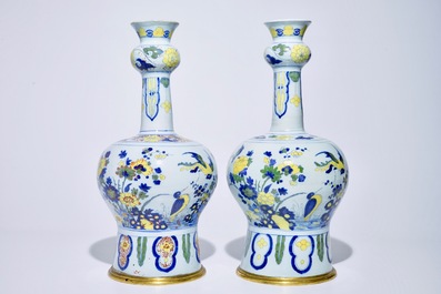 A pair of tall bronze-mounted polychrome Dutch Delft garlic-necked vases, late 17th C.