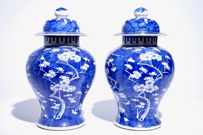 A pair of Chinese blue and white covered jars with &quot;prunus on breaking ice&quot; design, 19th C