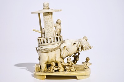 A fine Japanese ivory okimono of boys playing with an elephant, Meiji, 19th C., signed