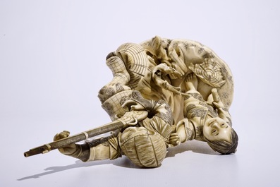 A Japanese ivory okimono of a hunter and his son, Meiji, late 19th C., signed