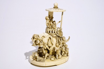 A fine Japanese ivory okimono of boys playing with an elephant, Meiji, 19th C., signed