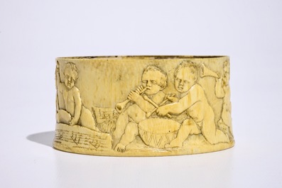 A finely carved ivory box with boys playing music, probably French, 18/19th C.