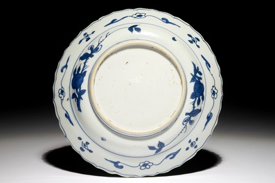 A Chinese blue and white fluted landscape dish, Ming