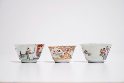 Three Chinese famille rose cups and two saucers, Yongzheng/Qianlong