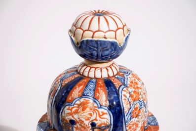 A Japanese Imari vase on stand and a Kutani model of a bijin, Meiji, 19th C.