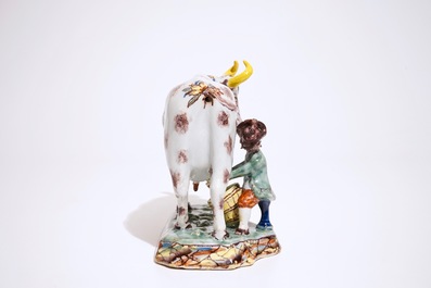 A polychrome Dutch Delft cow milking group, 18th C.