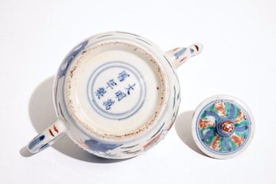 A Chinese wucai teapot and cover with figures in a garden, 19th C.