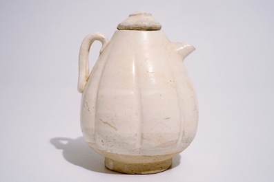 A Chinese cream-glazed melon-shaped ewer and cover, Song