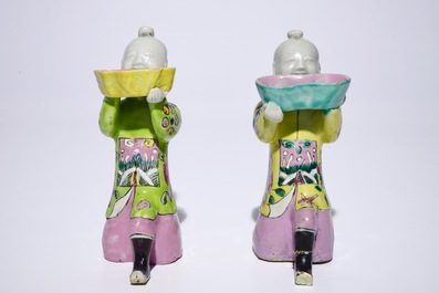 A pair of Chinese famille rose kneeling boy figures, 18/19th C.