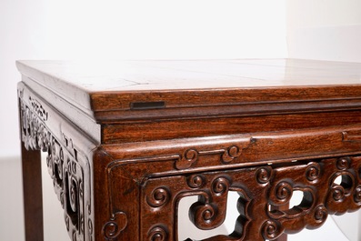 A Chinese carved hardwood table, 19/20th C.