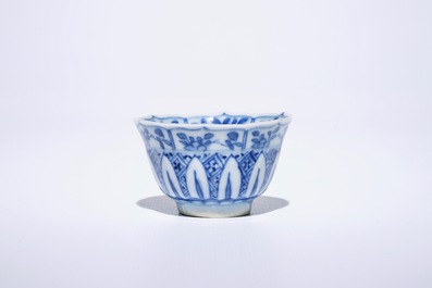 Six Chinese blue and white cups and saucers with figures in a garden, Kangxi