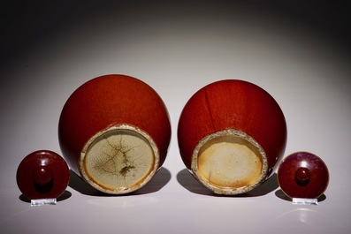 Two Chinese monochrome sang-de-boeuf-glazed covered jars, 19th C.