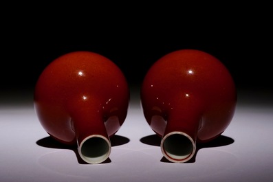 A pair of small Chinese monochrome copper red tianqiu ping bottle vases, 19/20th C.