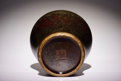 A Chinese monochrome tea-dust-glazed hu vase, Qianlong mark, 19th C.