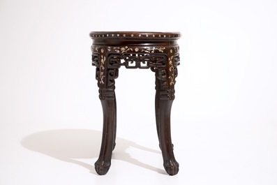 An oval Chinese marble-top mother of pearl inlaid sculpted wood stand, 19th C.