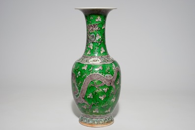 A Chinese green ground dragon vase, a small rouleau vase and a verte biscuit figure, 19th C.